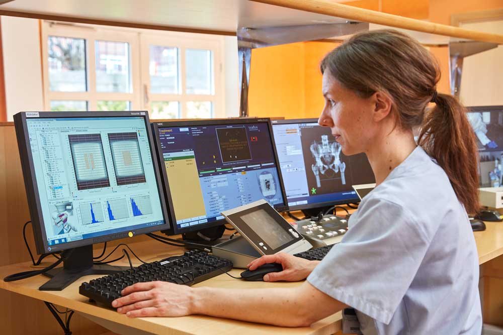 Medical Physicist looking at Delta4 software on screen